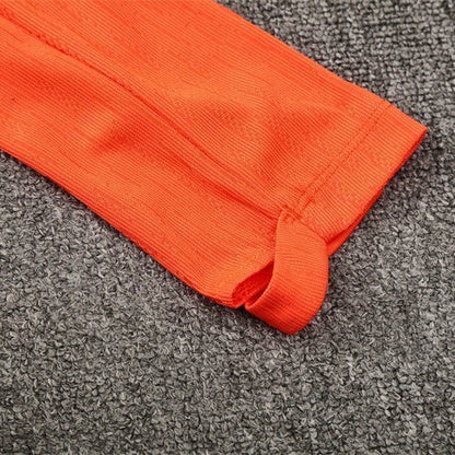 25/26 FC Barcelona Training Orange/Blue Kids Size Tracksuit from FootballPrestige.club - Premium Football Kits