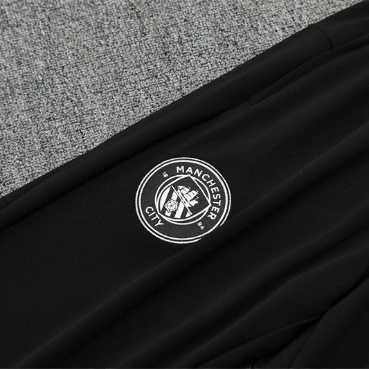 25/26 Manchester City x Asahi Black Tracksuit from FootballPrestige.club - Premium Football Kits