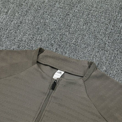 25/26 Real Madrid Training Dark Olive Tracksuit from FootballPrestige.club - Premium Football Kits
