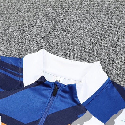 Real Madrid "Azul Reactor" Premium Kids Size Tracksuit from FootballPrestige.club - Premium Football Kits